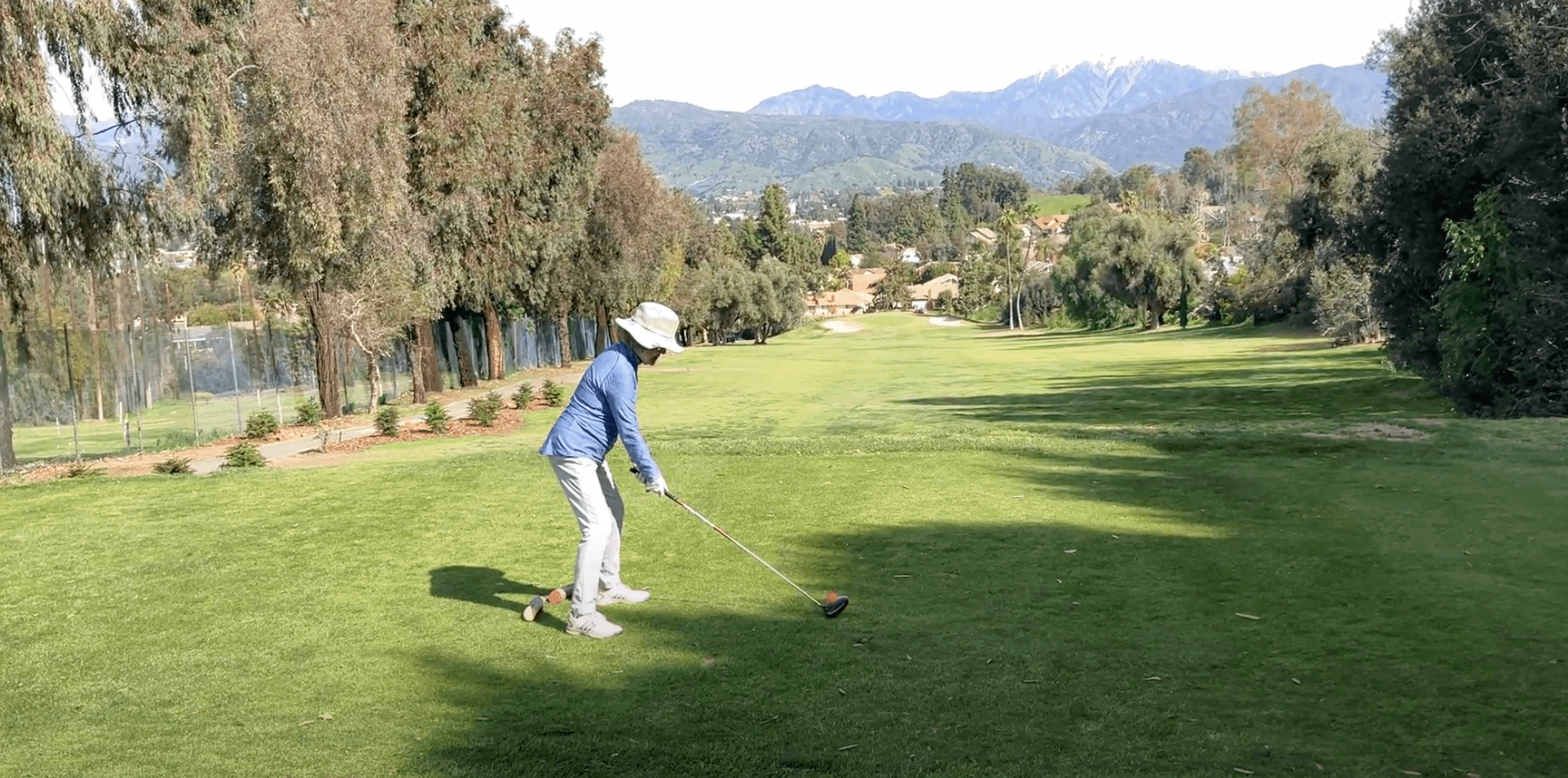 An adult golfer working on a drive during a private lesson